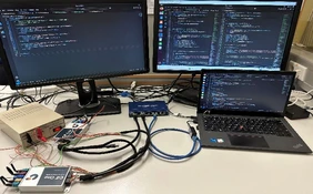 Source: THI Image of a laptop and two monitors in the background